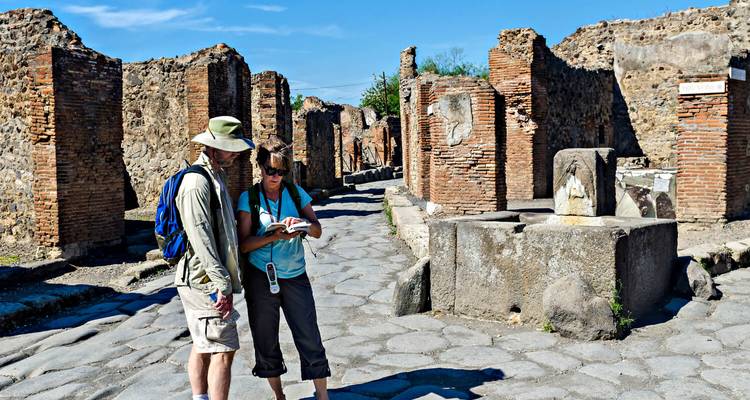 Two people exploring ancient ruins.