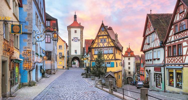 Charming medieval street with colorful half-timbered houses.