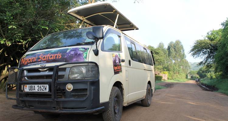 Safari van parked on rural dirt road