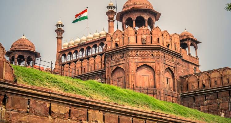 The Red Fort with an Indian flag atop, showcasing its stunning architecture.