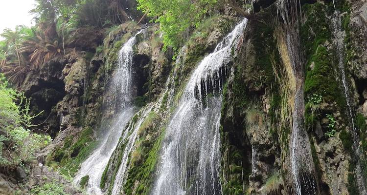Waterfalls cascading down a rocky cliff