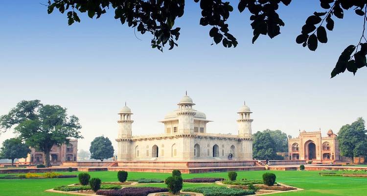 Historical structure surrounded by well-kept gardens.