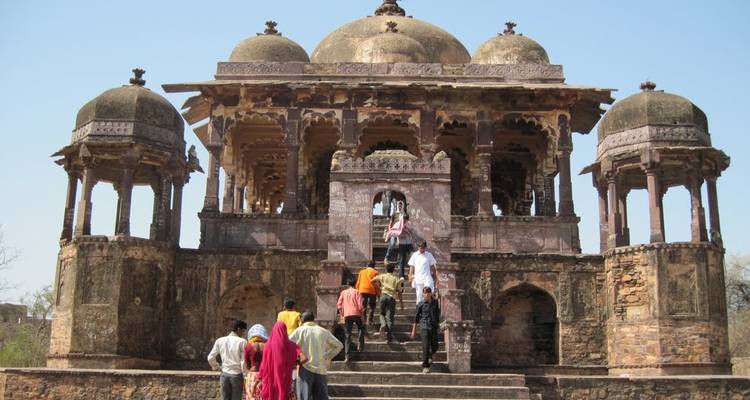 People climbing the steps of an ancient temple.