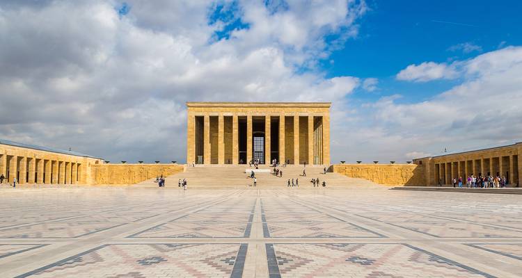 Anıtkabir in Ankara with geometric ground patterns and visitors.