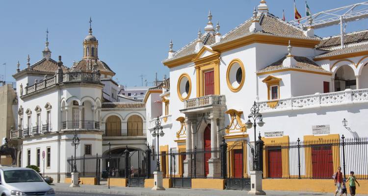 Historical building facade in a city with clear skies.