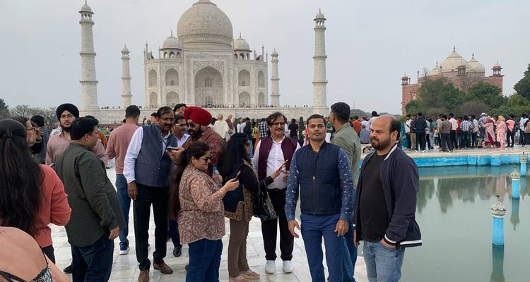 Visitors in front of the Taj Mahal.