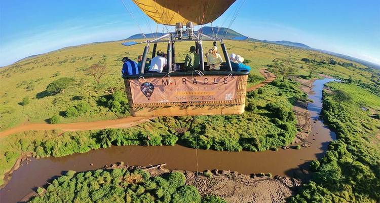 Hot air balloon over a scenic landscape under a clear sky