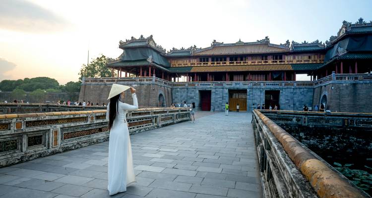 Woman standing by the Imperial City in Hue, Vietnam.