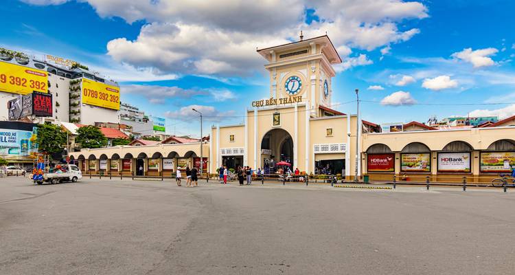 Ben Thanh Market in Ho Chi Minh City with people in the square.