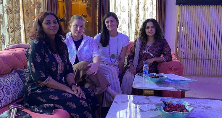 Group of women sitting indoors.