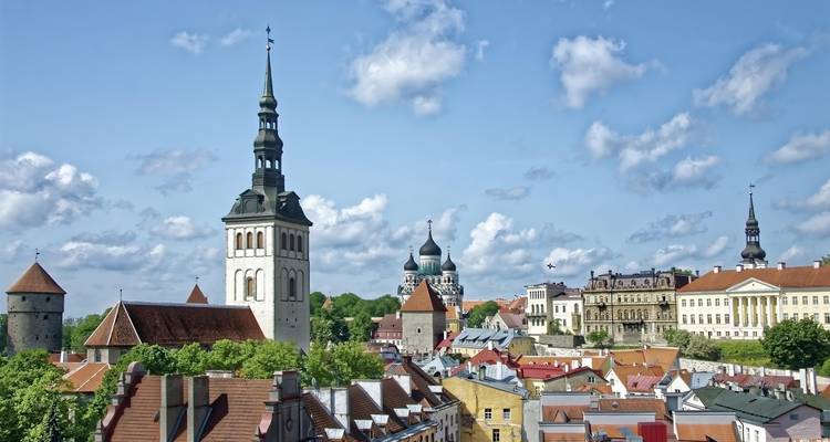Cityscape of Tallinn with prominent towers and buildings.
