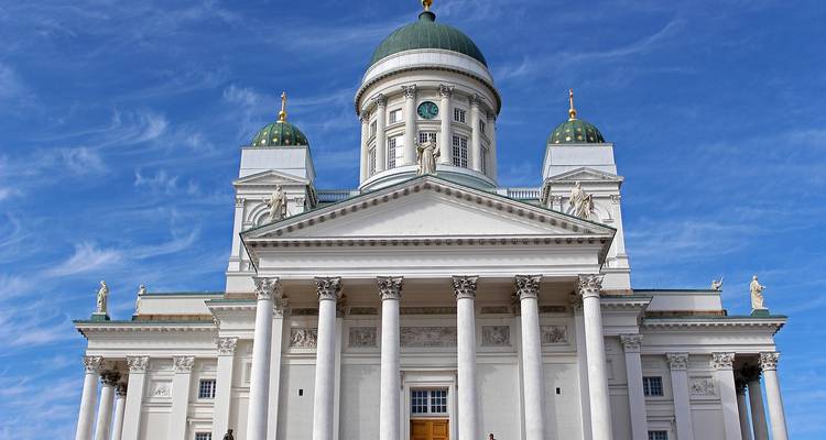 The Helsinki Cathedral against a bright blue sky.