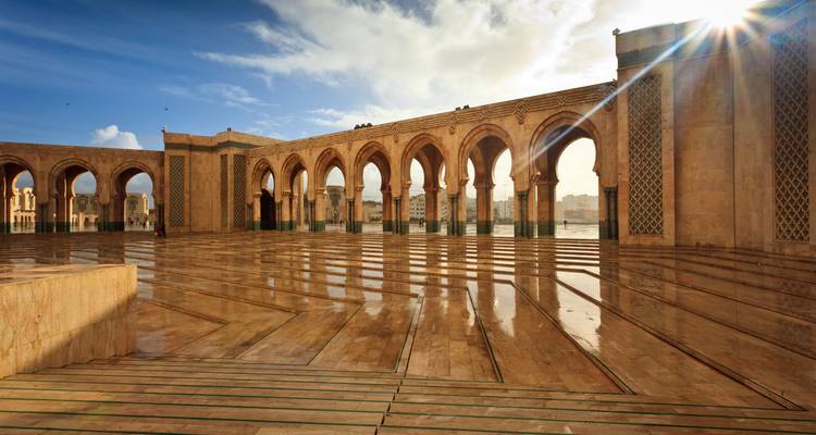 Wide view of an ornately designed mosque courtyard.