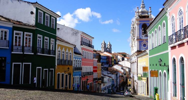 Vibrantly colored colonial buildings on a cobblestone street.