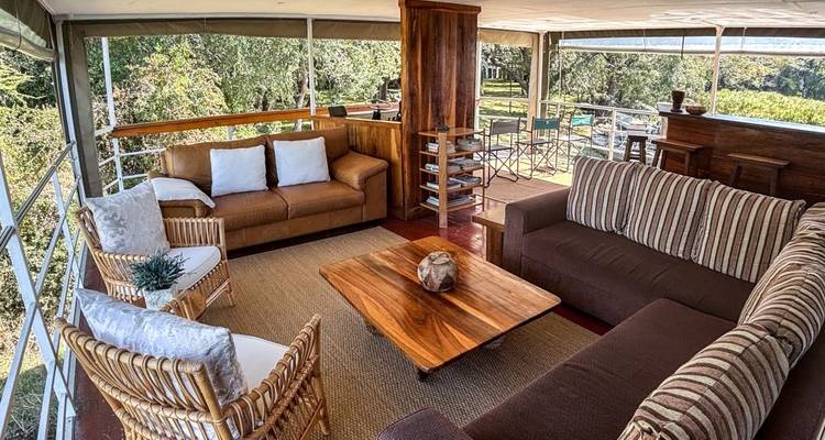 Indoor living area with comfortable couches on a houseboat.