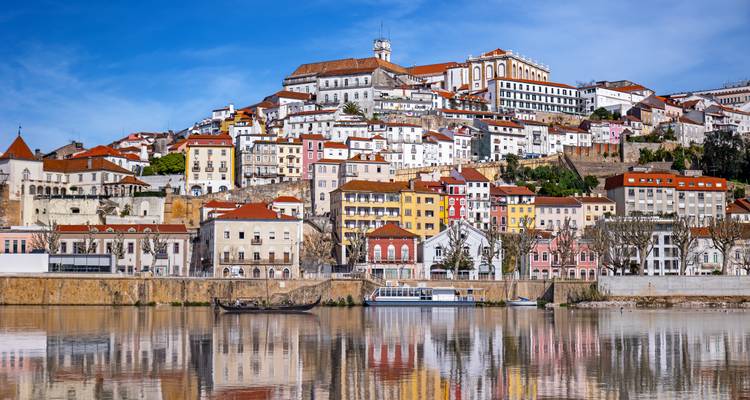 Quaint town with colorful houses by the river.