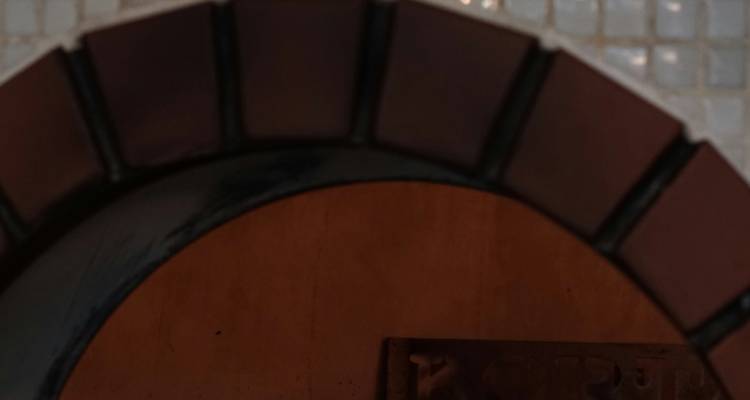 Blurry close-up of a tiled arch.