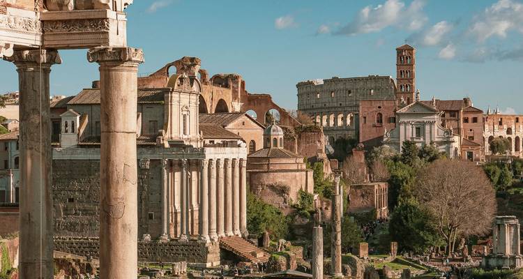 Panoramic view of Roman ruins with clear blue skies.