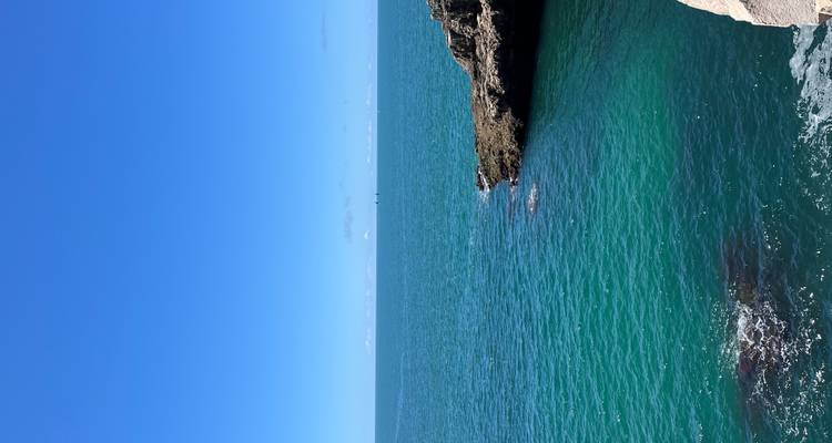 Vast blue ocean under a clear sky.