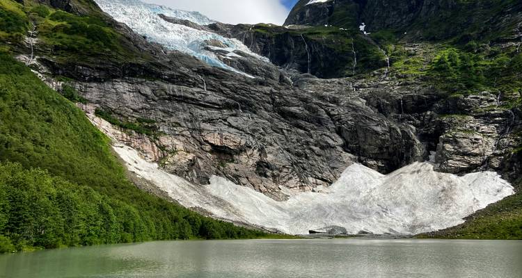 Scenic view of a glacier over a tranquil lake.
