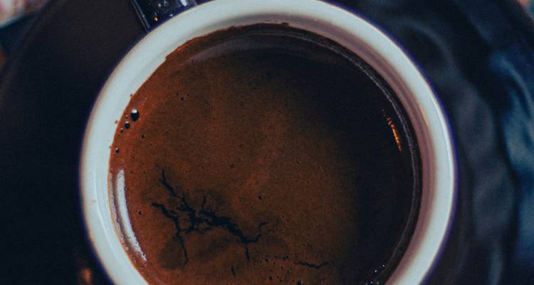 Close-up of a cup of dark coffee.