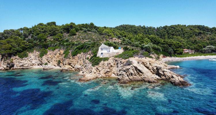 Aerial view of a coastline with a stone structure.