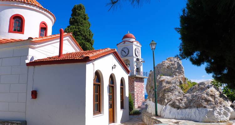 Church with a clock tower and blue sky.