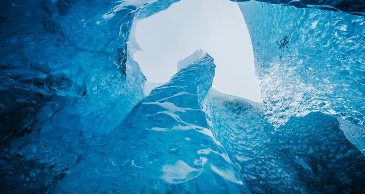 Inside view of a blue ice cave.