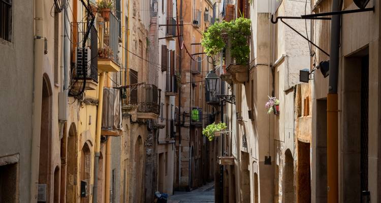 Narrow street in a medieval town with balconies.