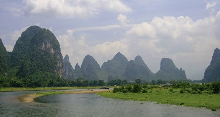 Karst mountains and a river on a clear day.
