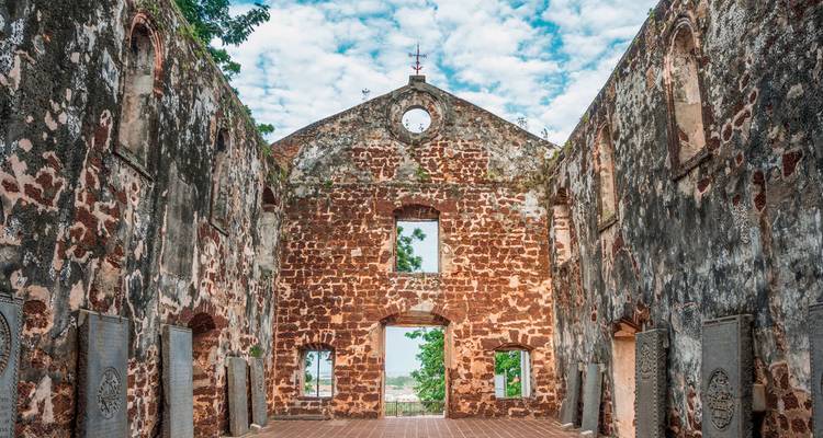 Interior ruins of a historic brick church.
