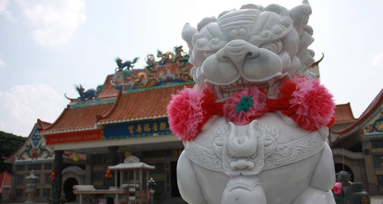 Statue in a temple with intricate details in Bangkok.