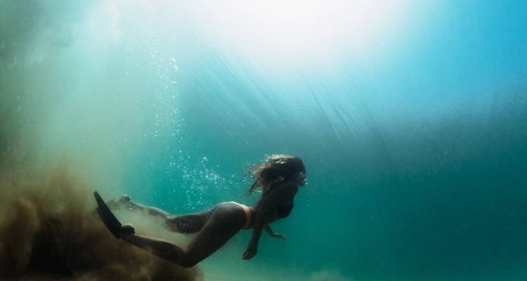 Underwater shot of a woman diving