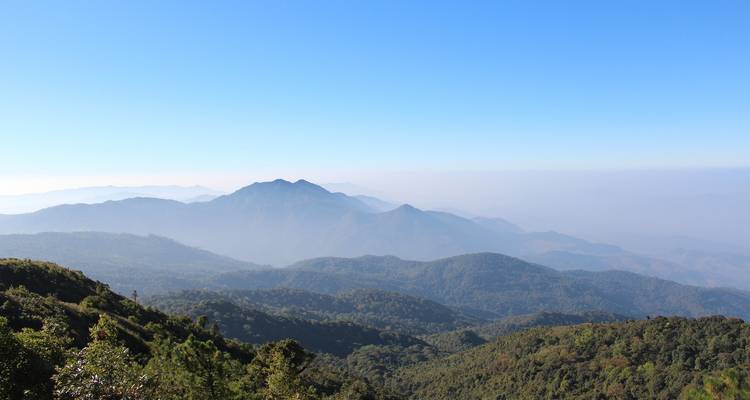 Mountainous landscape with layers of rolling hills.