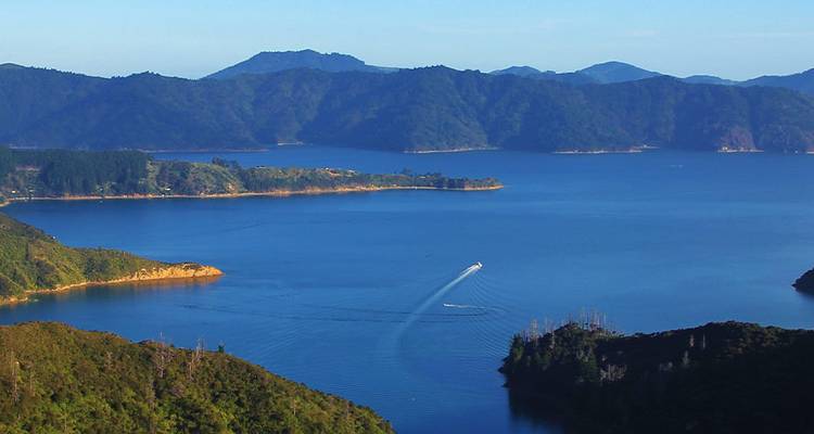 View of a body of water with mountains in the distance.
