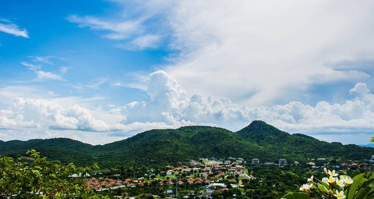Scenic view of green hills under a blue sky.