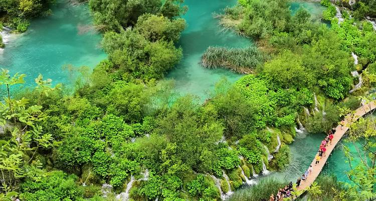 Plitvice Lakes National Park with lush greenery and turquoise waters.