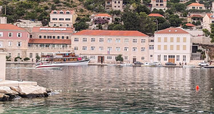 A picturesque coastal town with a boat in the dock.
