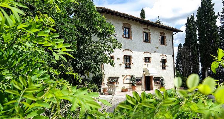 Villa surrounded by greenery.