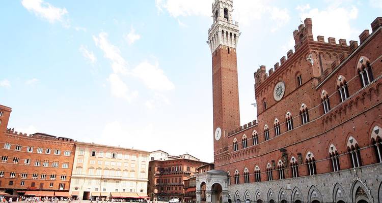 Piazza del Campo with tall tower and buildings.