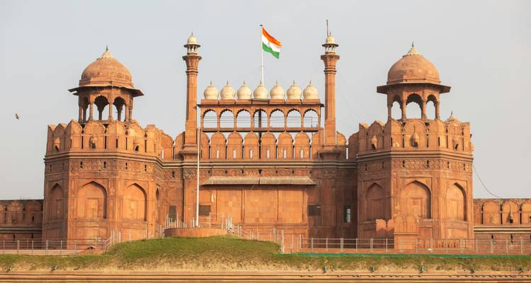 Red Fort's front view with Indian flag on top.