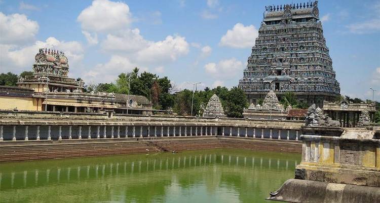 Large Hindu temple with a stepped pond.