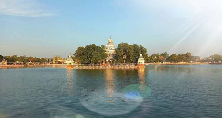 Temple complex surrounded by a large water body.