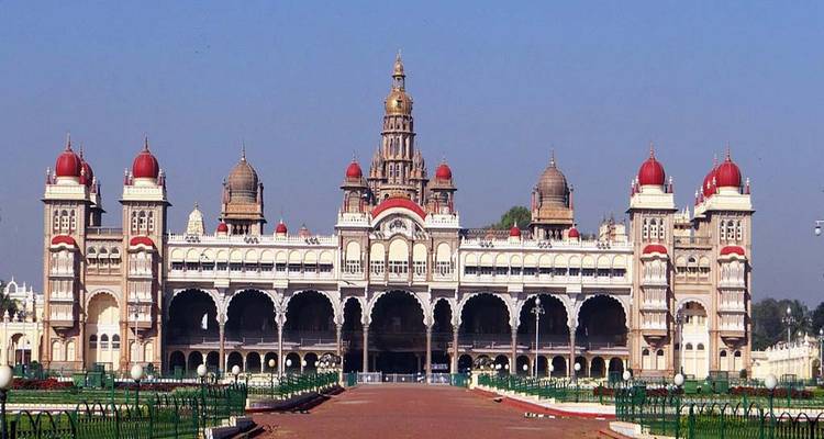Royal palace with red domes and arched balconies.