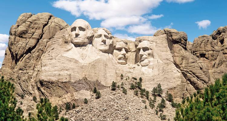 Close-up view of Mount Rushmore with clear blue sky.