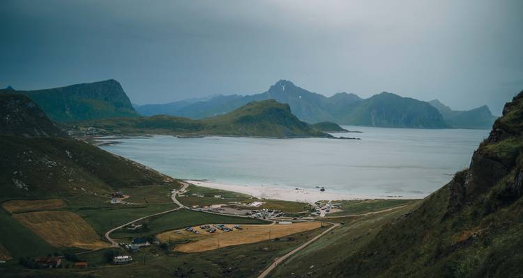 Coastal plains with mountains in the background.