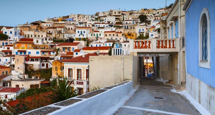 Colorful hillside village with traditional buildings.