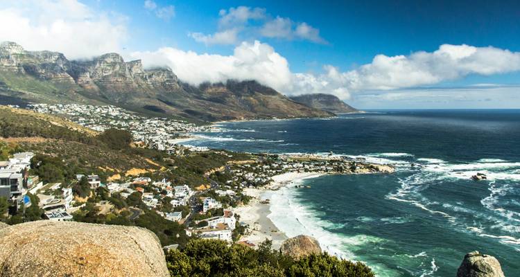 Coastal town with mountains and ocean.