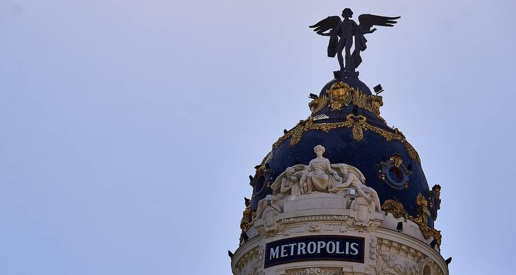 Close-up of the Metropolis building's dome and statue.