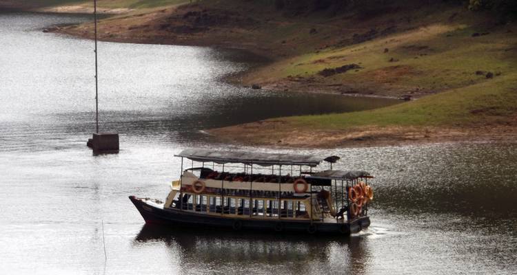 Tourist boat on a calm river or lake.